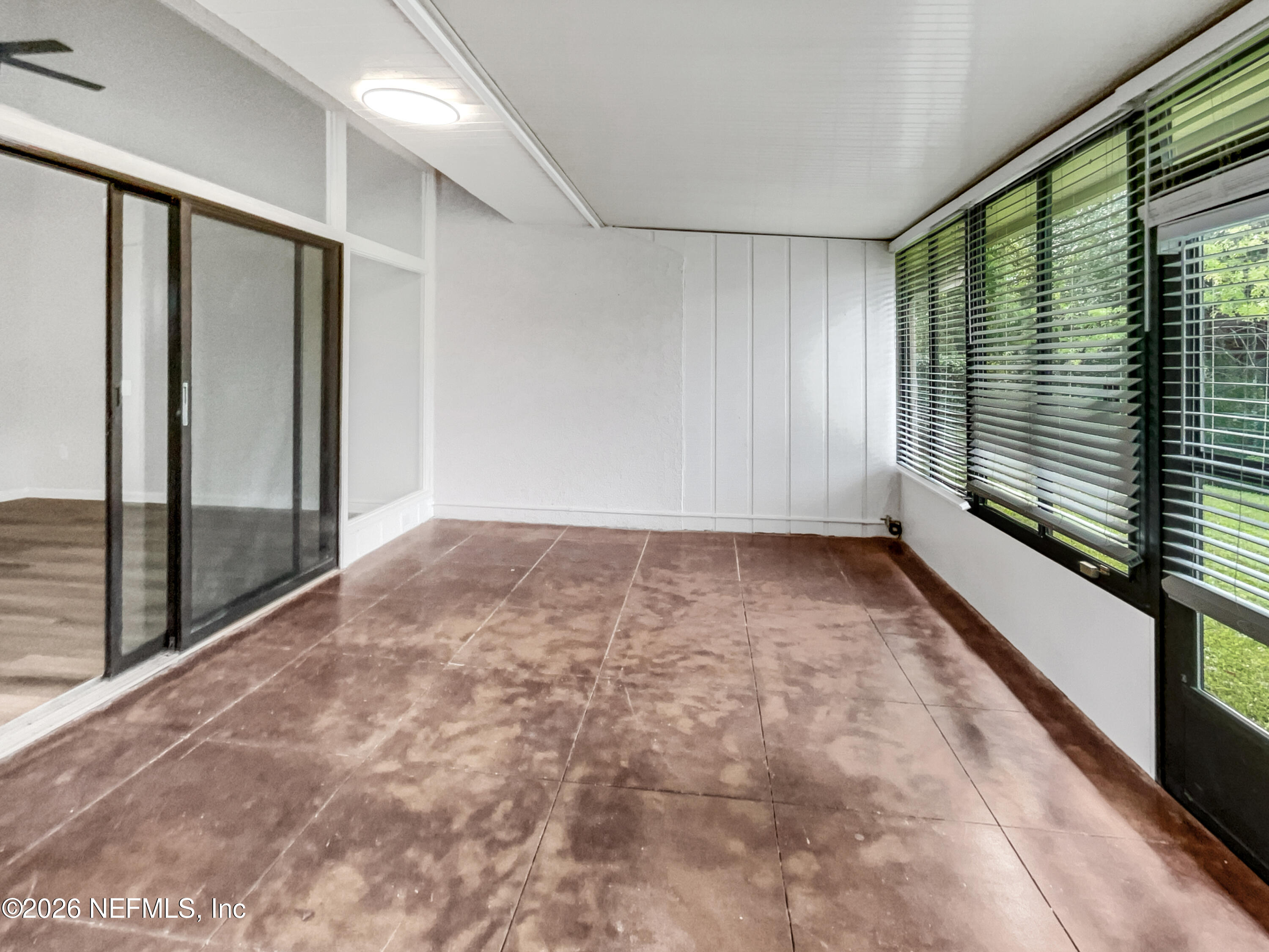 7208 Cypress Cove Road, Unit 13 Jacksonville, FL 32244 - Photo 21 of 22 a view of an empty room and window