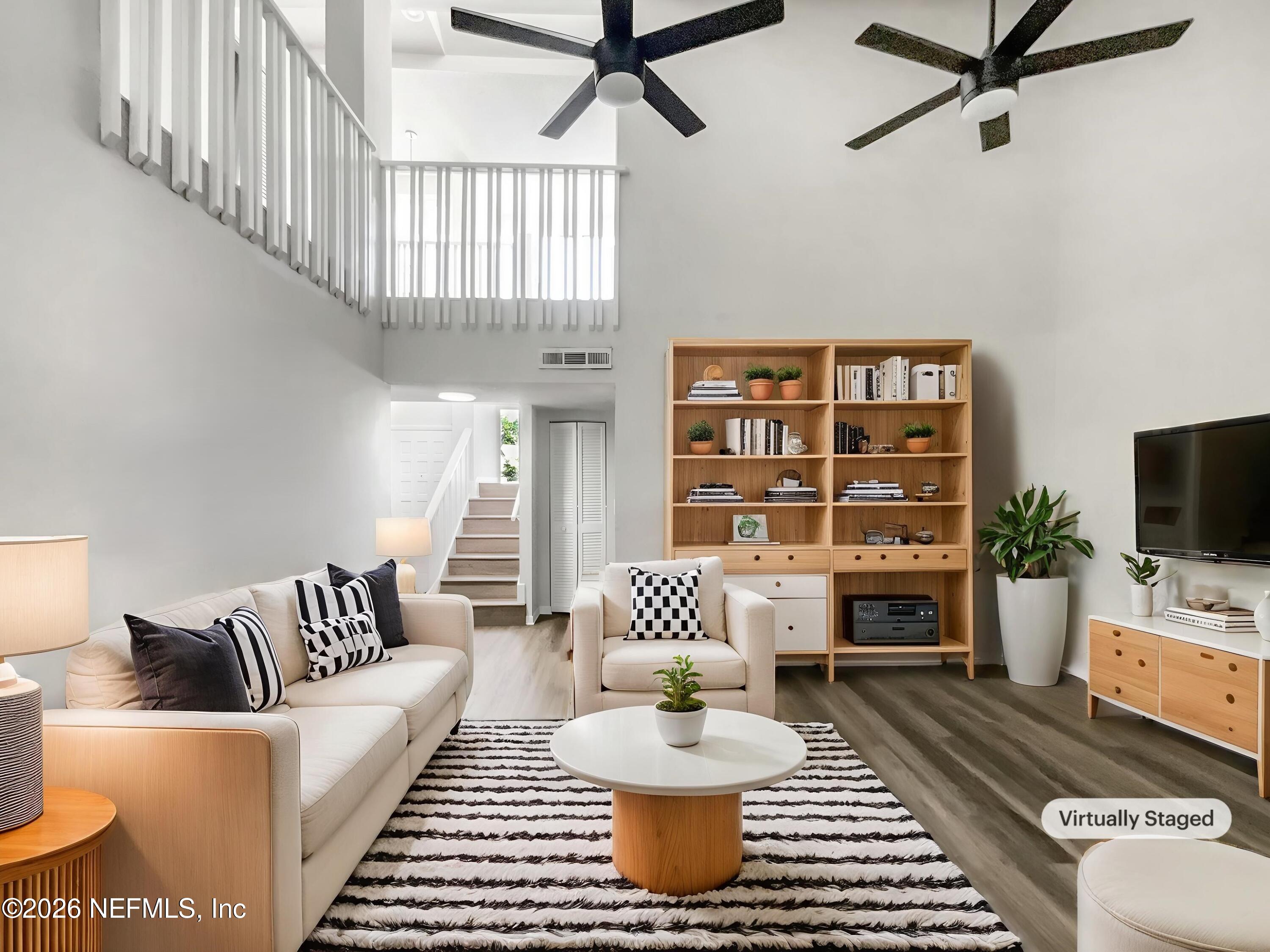 7208 Cypress Cove Road, Unit 13 Jacksonville, FL 32244 - Photo 3 of 22 a living room with furniture and a flat screen tv