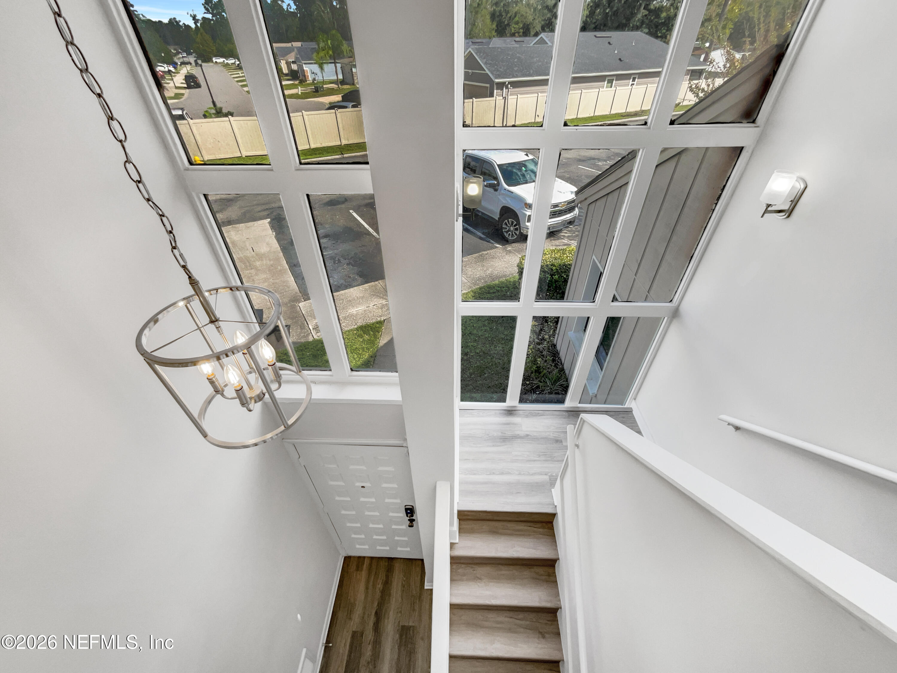 7208 Cypress Cove Road, Unit 13 Jacksonville, FL 32244 - Photo 10 of 22 a view of staircase with white walls and a window
