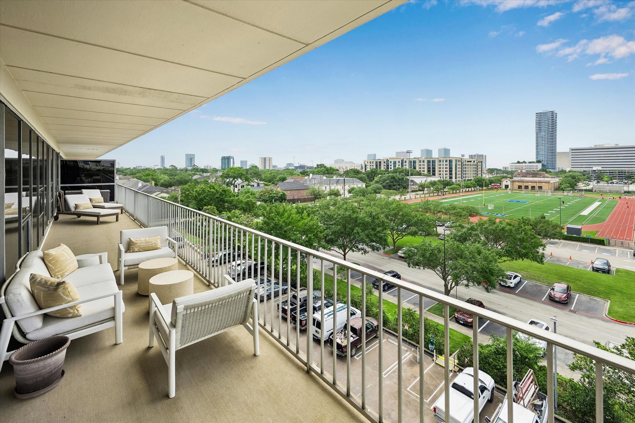 2200 Willowick Road, Unit 5C Houston, TX 77027 - Photo 5 of 27 Covered balcony with outdoor sisal carpeting. South facing views.