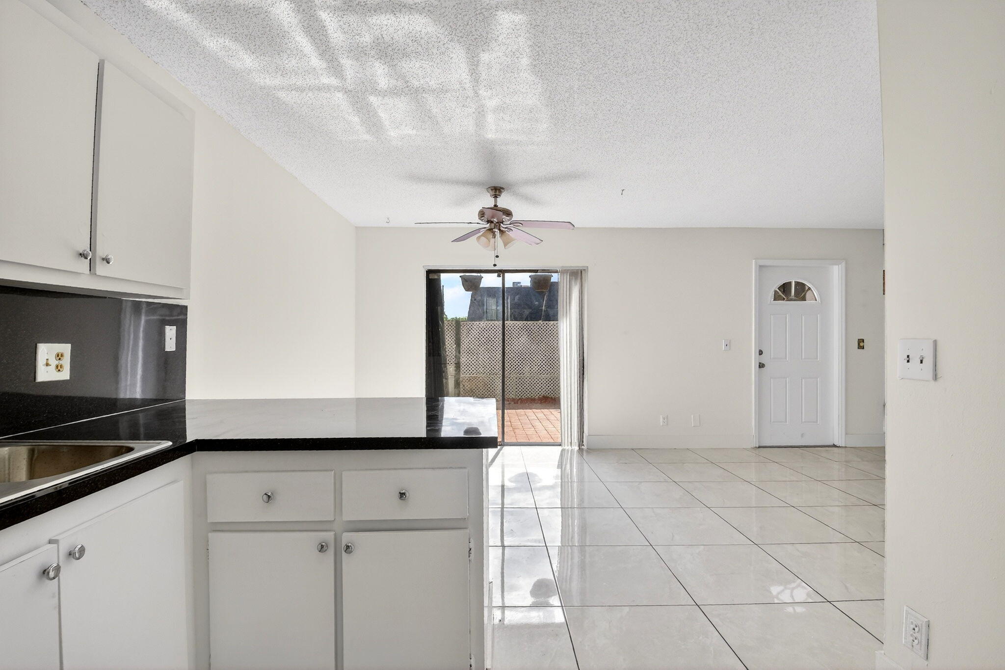 136 Woodland Road Palm Springs, FL 33461 - Photo 13 of 42 a view of an empty room and window