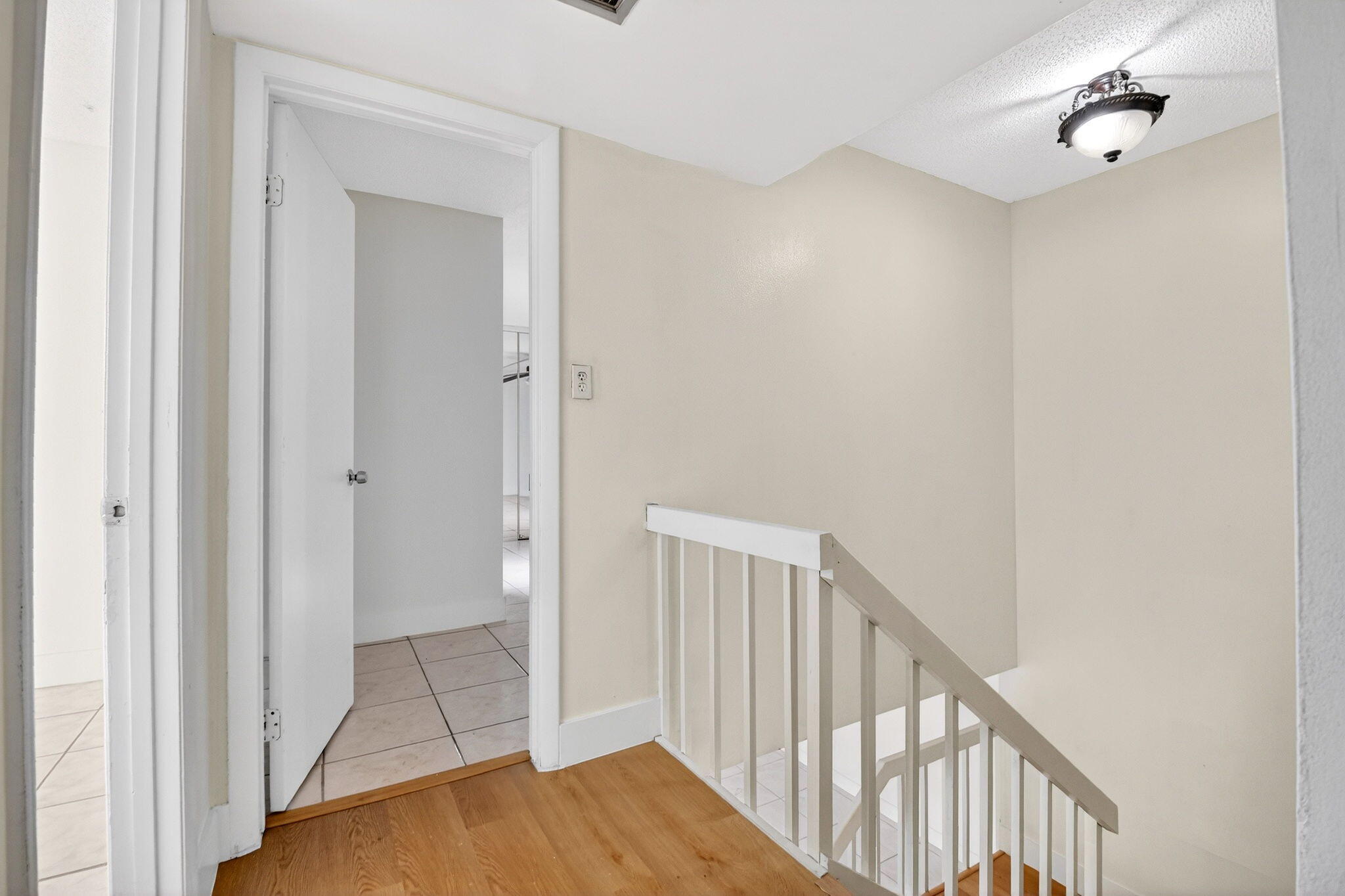 136 Woodland Road Palm Springs, FL 33461 - Photo 24 of 42 a view of a hallway with a door and stairs
