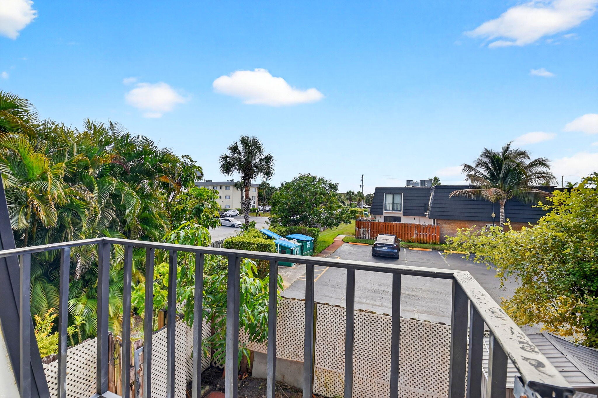 136 Woodland Road Palm Springs, FL 33461 - Photo 28 of 42 a view of a balcony and a street