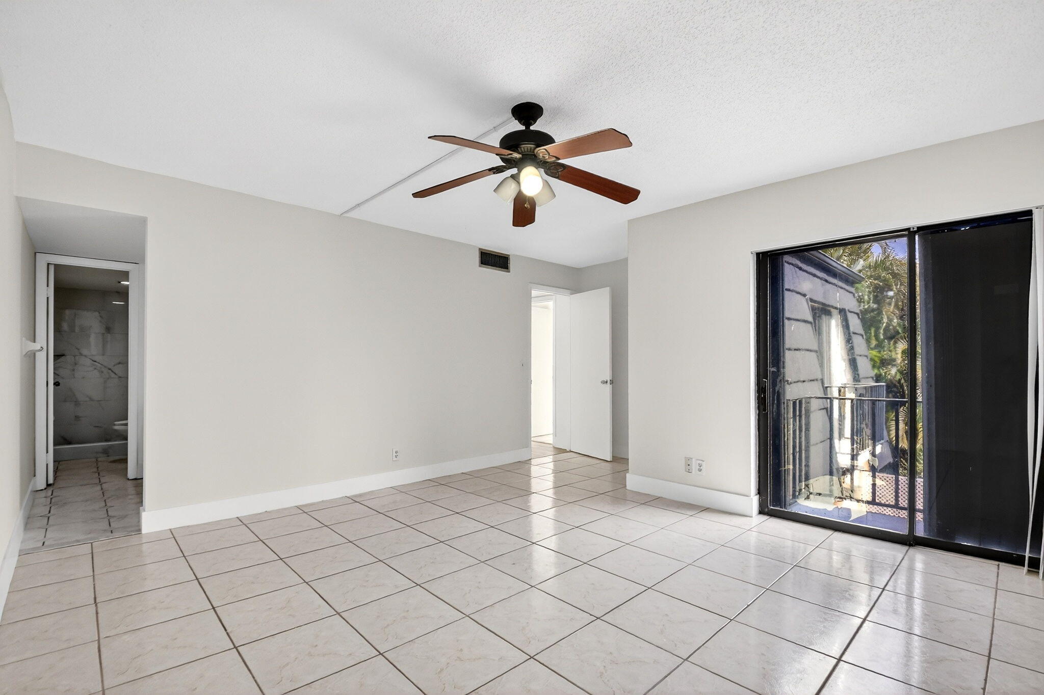 136 Woodland Road Palm Springs, FL 33461 - Photo 30 of 42 a view of a livingroom with a ceiling fan and window