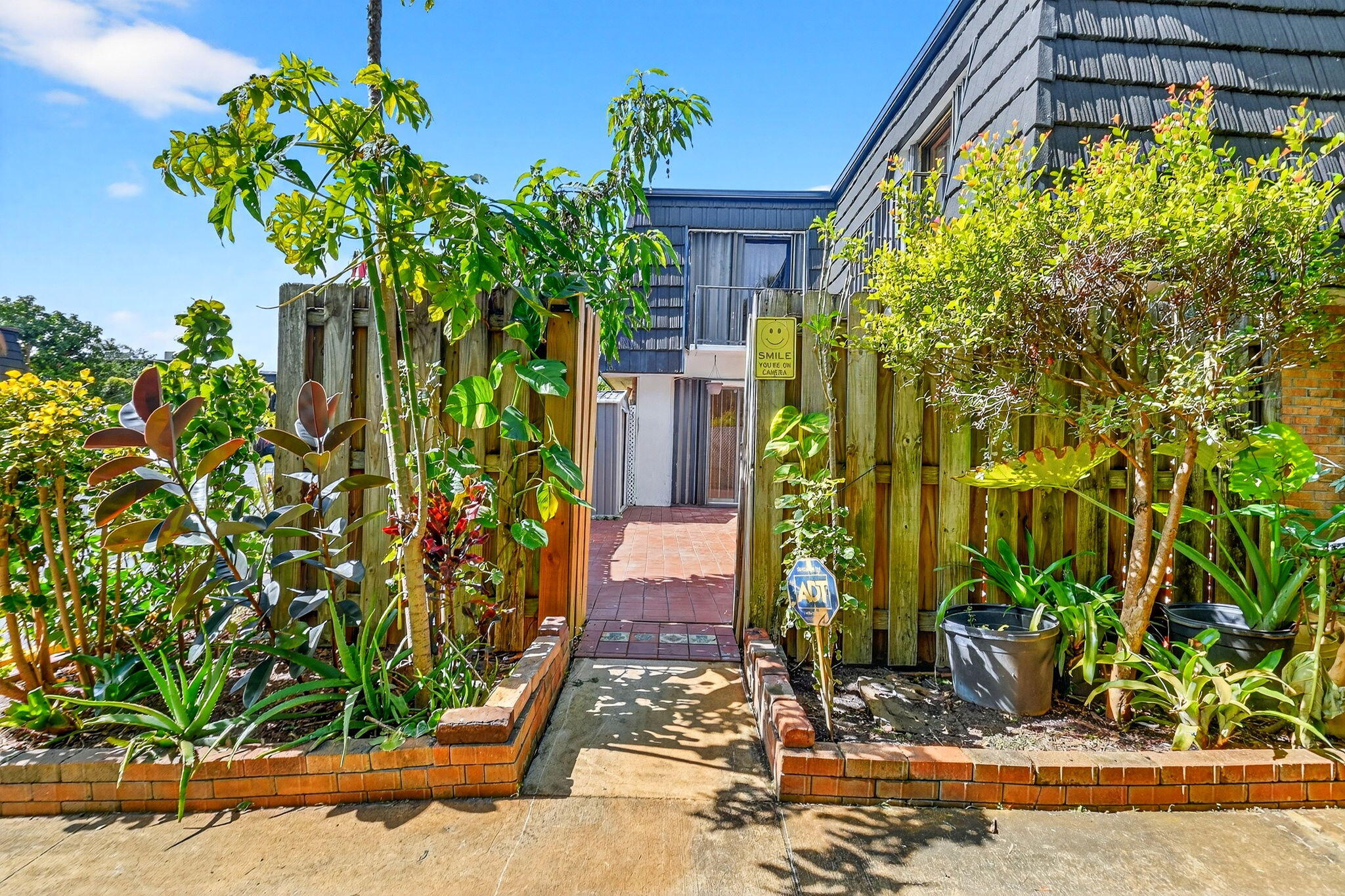 136 Woodland Road Palm Springs, FL 33461 - Photo 3 of 42 a front view of a house with a yard