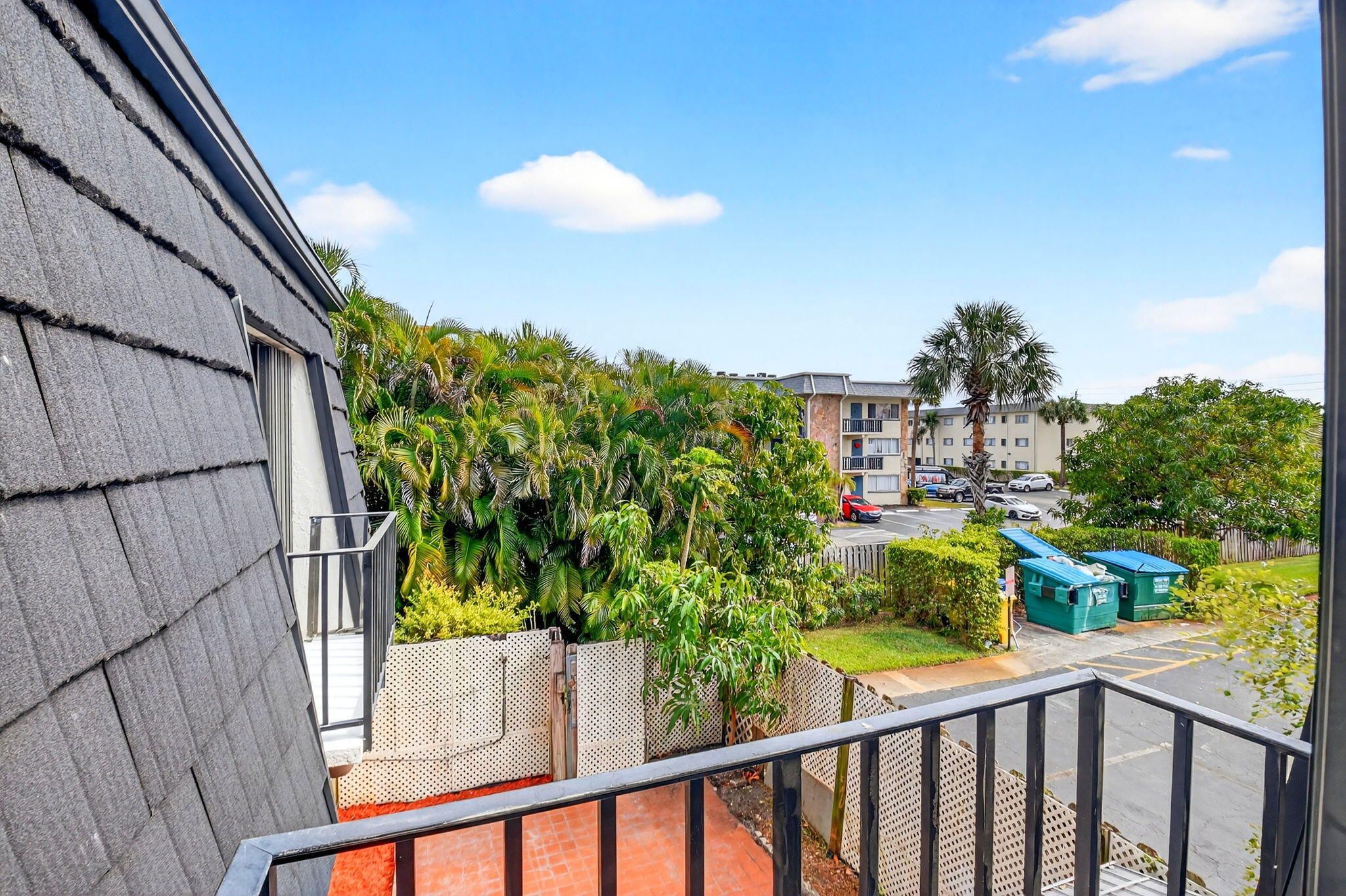 136 Woodland Road Palm Springs, FL 33461 - Photo 34 of 42 a view of a garden from a balcony