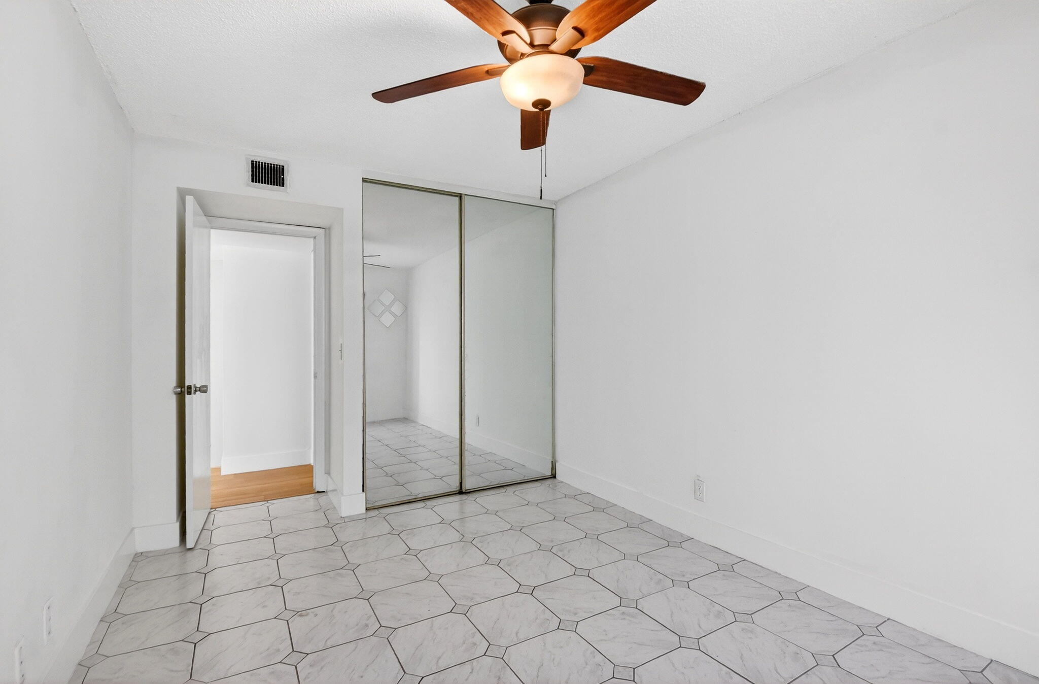 136 Woodland Road Palm Springs, FL 33461 - Photo 36 of 42 a view of an empty room