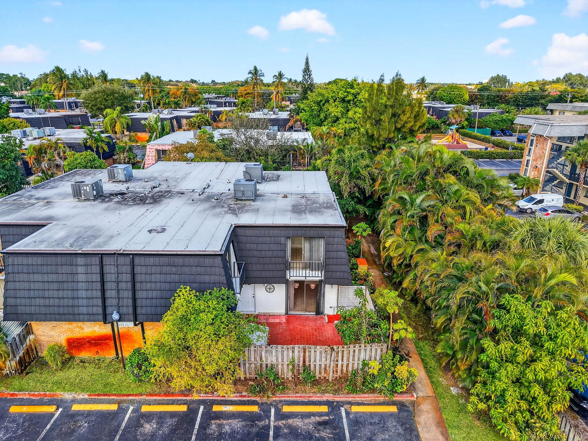 136 Woodland Road Palm Springs, FL 33461 - Photo 40 of 42 an aerial view of multiple houses with yard