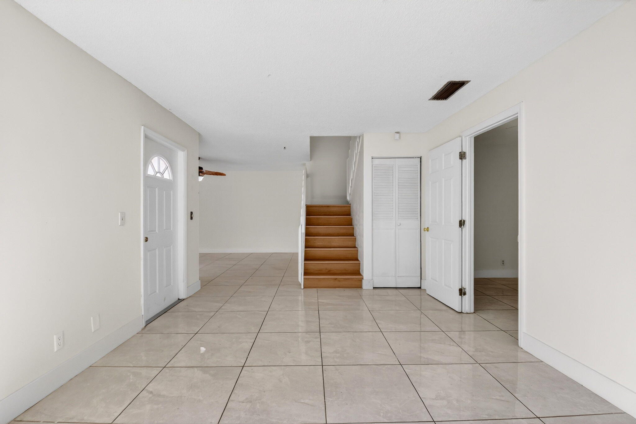 136 Woodland Road Palm Springs, FL 33461 - Photo 7 of 42 a view of an empty room with a window