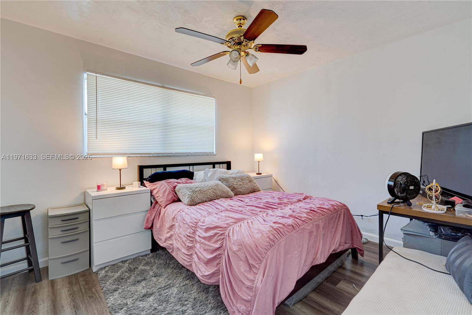 502-504 Phippen Waiters Road, Unit 4 Dania Beach, FL 33004 - Photo 15 of 16 a bedroom with bed and a night stand