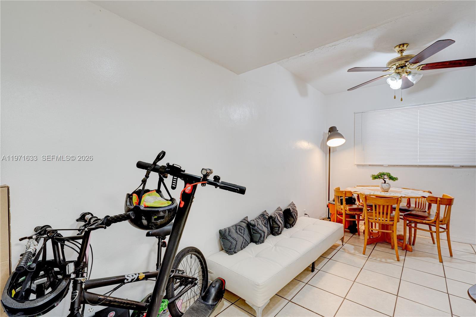 502-504 Phippen Waiters Road, Unit 4 Dania Beach, FL 33004 - Photo 3 of 16 a living room with furniture and a mirror