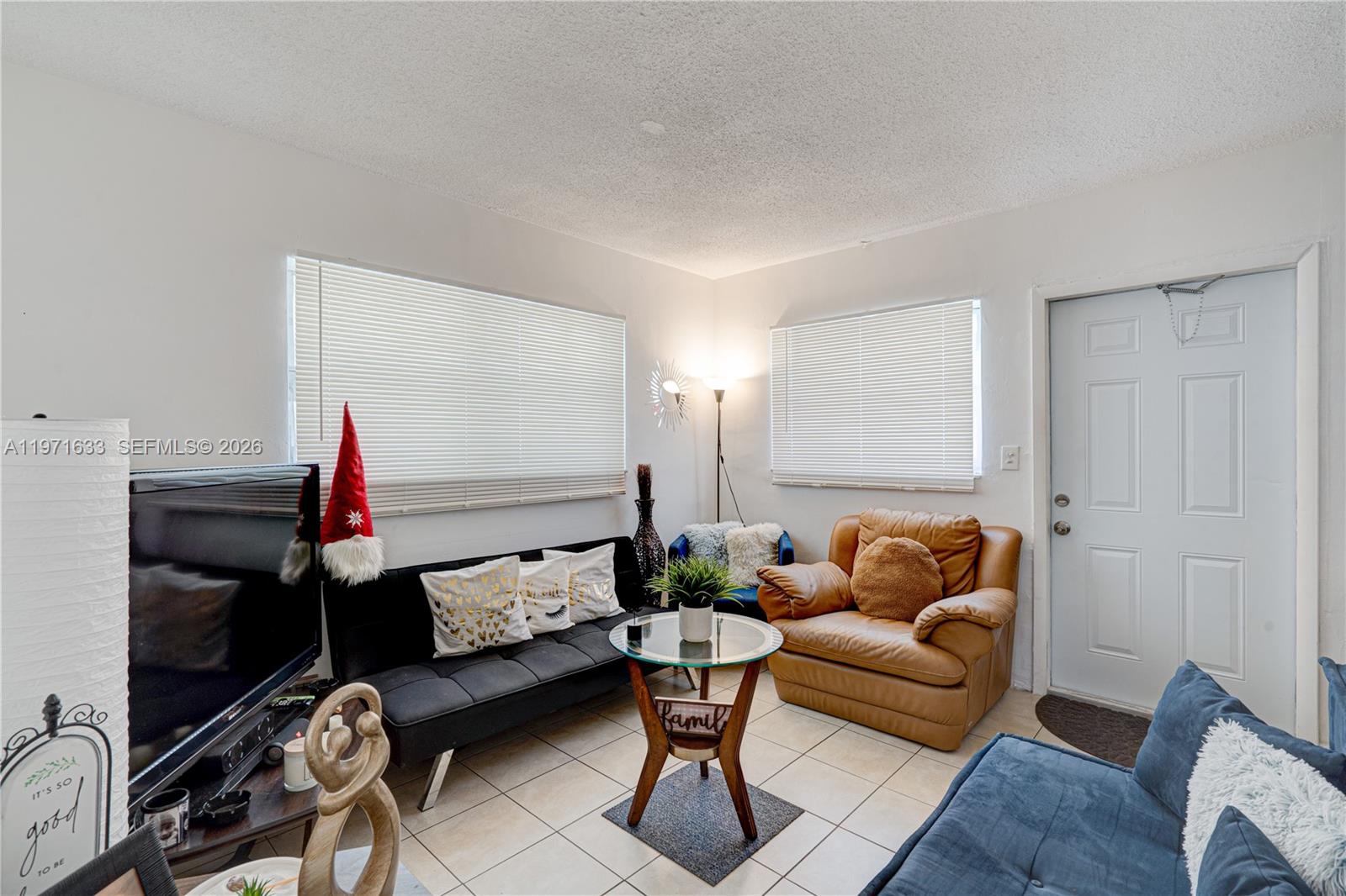 502-504 Phippen Waiters Road, Unit 4 Dania Beach, FL 33004 - Photo 5 of 16 a living room with furniture