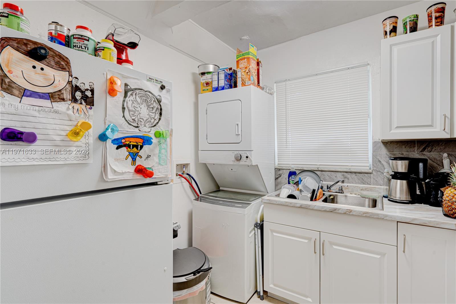 502-504 Phippen Waiters Road, Unit 4 Dania Beach, FL 33004 - Photo 10 of 16 a room with toys and a shelf