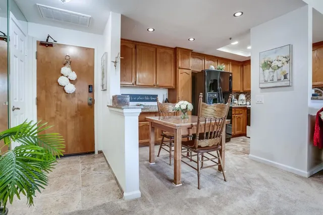 a dining room with furniture and window