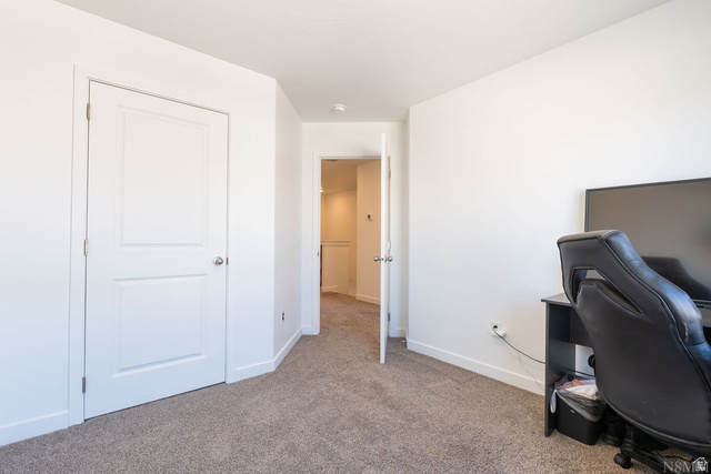 1693 Devils Gdn Lane Washington, UT 84780 - Photo 21 of 64 Neutral-toned carpet flooring and bright white walls