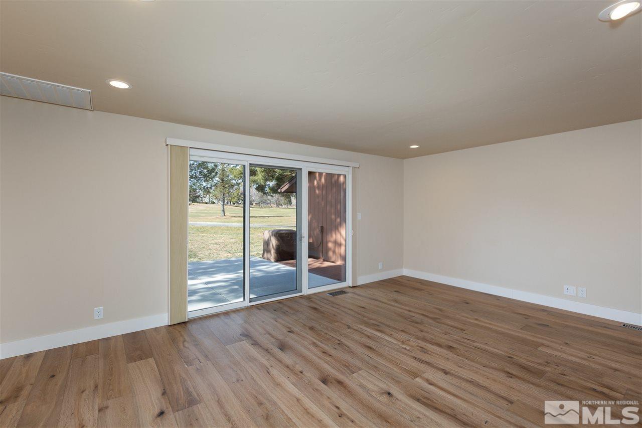 1969 South Villa Way Reno, NV 89509 - Photo 11 of 25 wooden floor in an empty room with a window
