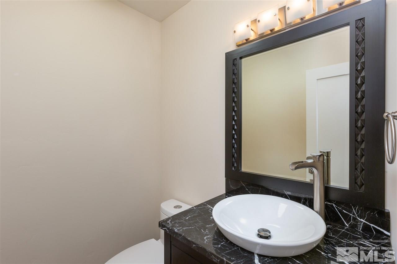 1969 South Villa Way Reno, NV 89509 - Photo 13 of 25 a bathroom with a sink and a mirror