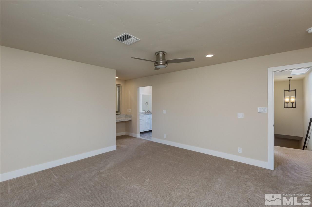 1969 South Villa Way Reno, NV 89509 - Photo 15 of 25 an empty room with a ceiling fan and closet area