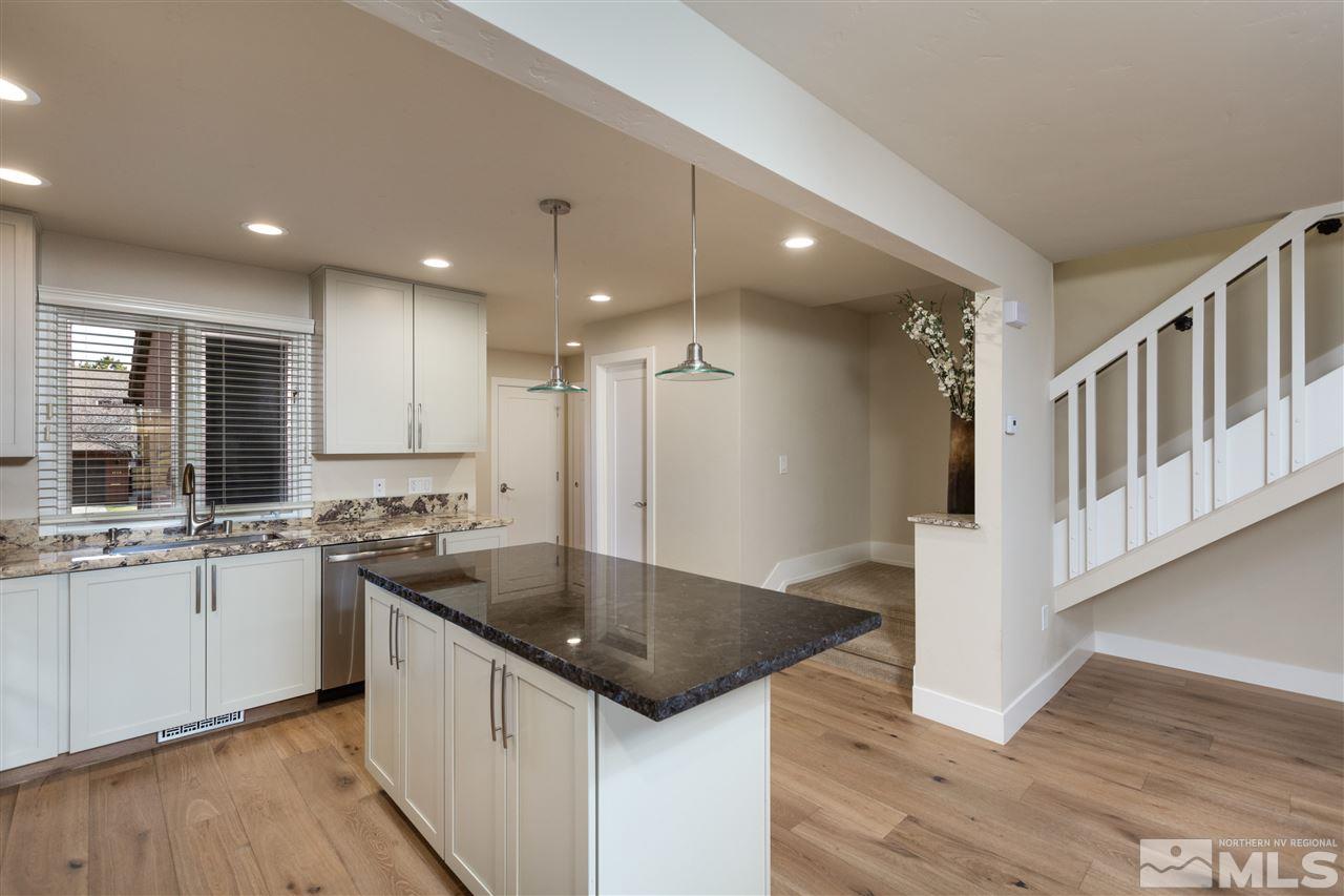 1969 South Villa Way Reno, NV 89509 - Photo 5 of 25 a kitchen with stainless steel appliances granite countertop a sink stove and cabinets