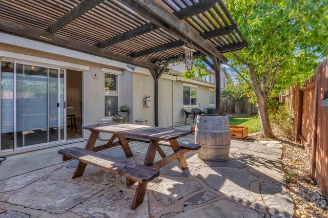 a building outdoor space with patio furniture and wooden floor