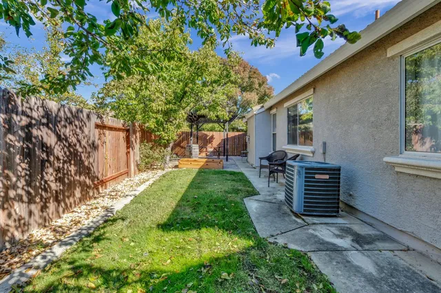 a view of a backyard with sitting area