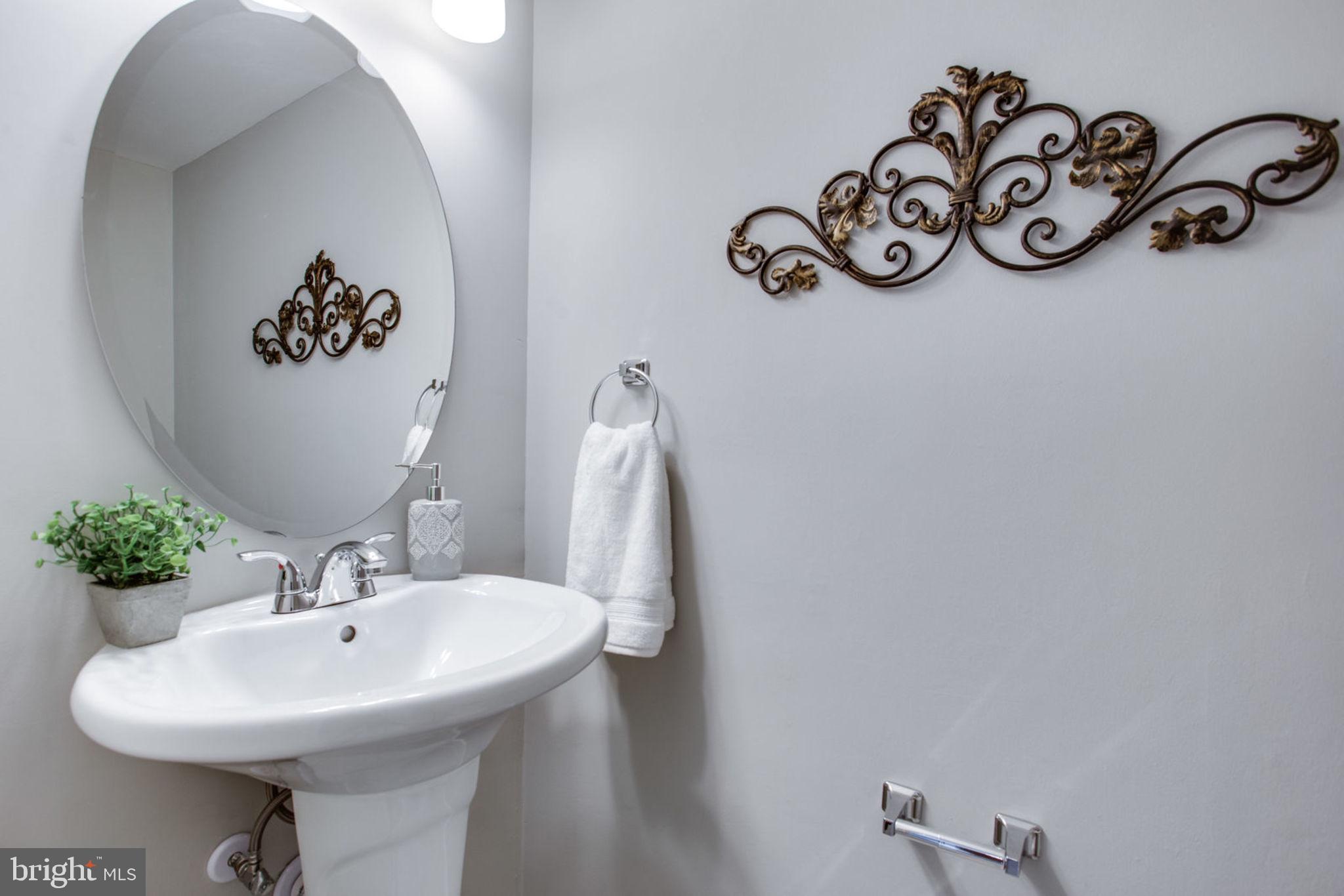 New Sink and title floor in Powder Room
