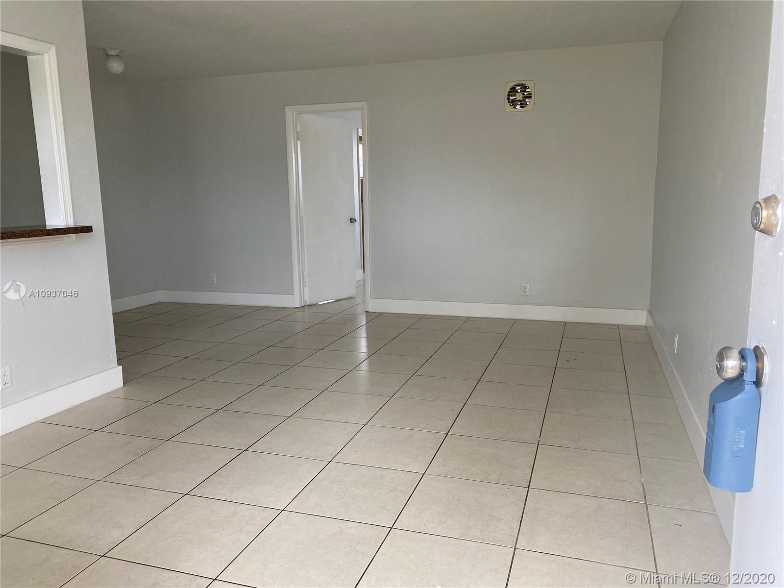an empty room with a bathroom