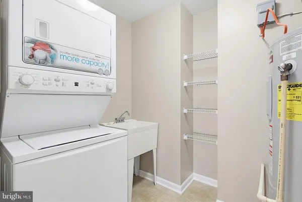 a view of washer and dryer with wooden floor