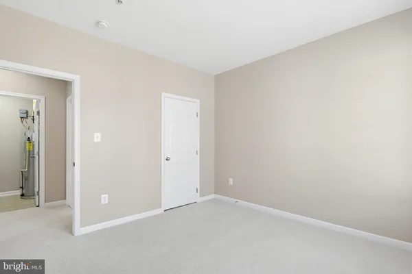 an empty room with closet area