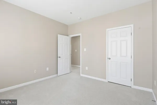 an empty room with windows and gate