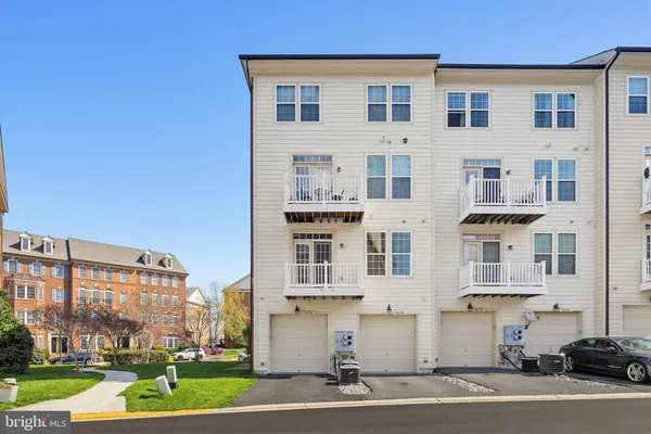 a large building with a yard in front of it