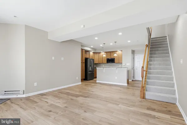 a view of a kitchen with a sink and cabinets