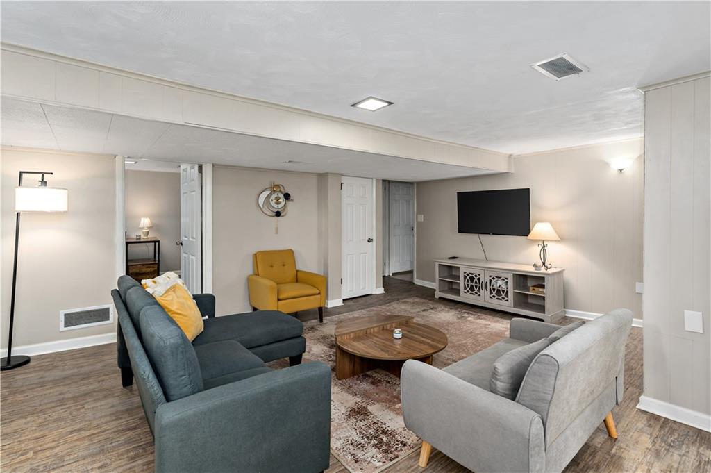 231 Woodside Road Pittsburgh, PA 15221 - Photo 19 of 34 a living room with furniture and a flat screen tv