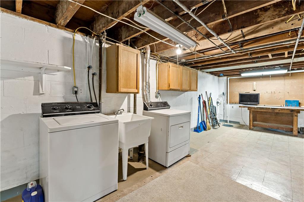 231 Woodside Road Pittsburgh, PA 15221 - Photo 25 of 34 a view of storage and utility room with washer and dryer