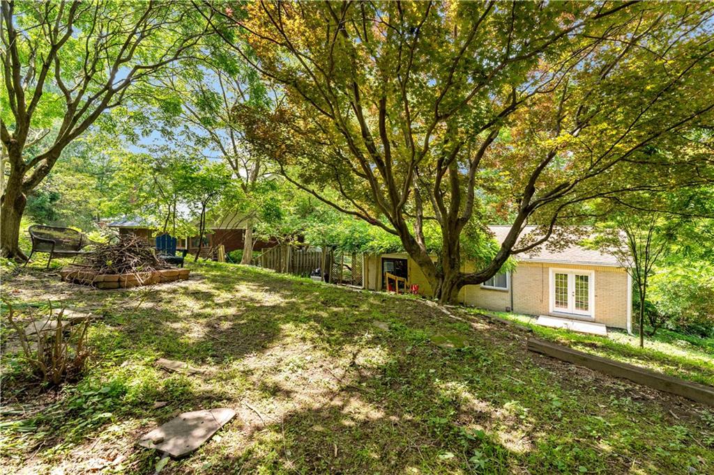 231 Woodside Road Pittsburgh, PA 15221 - Photo 30 of 34 a view of a yard with plants and trees