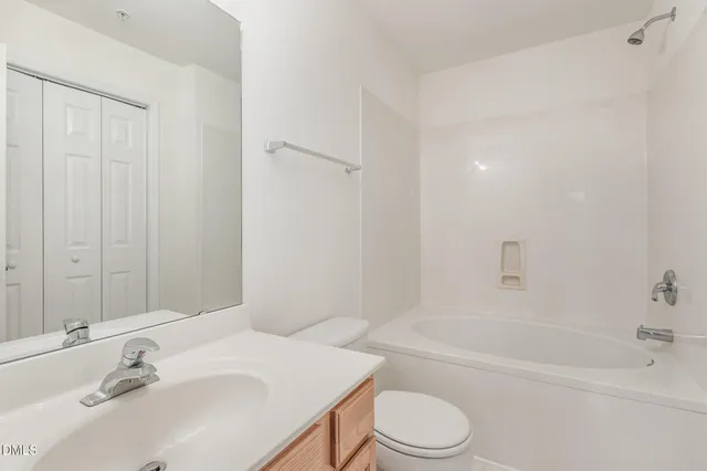 a bathroom with a sink toilet and a bathtub