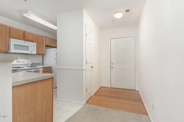 a view of a kitchen with electric appliances