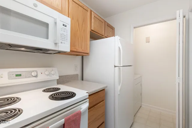 a kitchen with a stove and a refrigerator