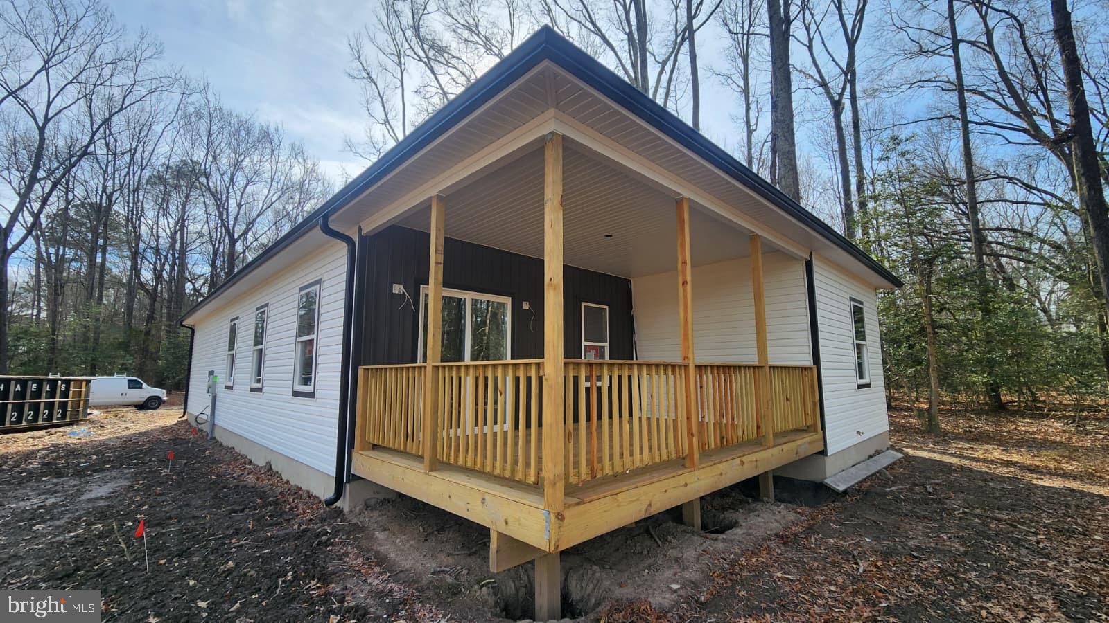 175 Rose Way Colonial Beach, VA 22443 - Photo 2 of 16 a view of a small house with a yard