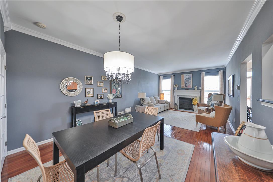 163 Muirfield Way Easton, PA 18042 - Photo 5 of 48 a view of a dining room and livingroom with furniture wooden floor a chandelier