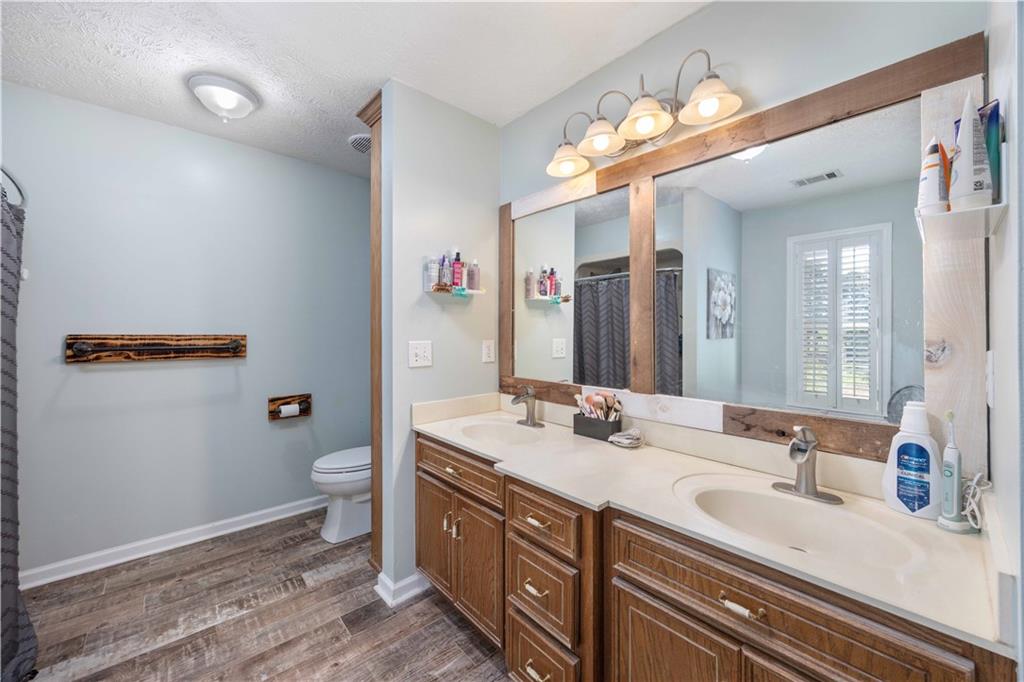 62 McCarthy Road Opelika, AL 36804 - Photo 25 of 74 Dual vanity with integrated sinks and wood-finish cabinetry