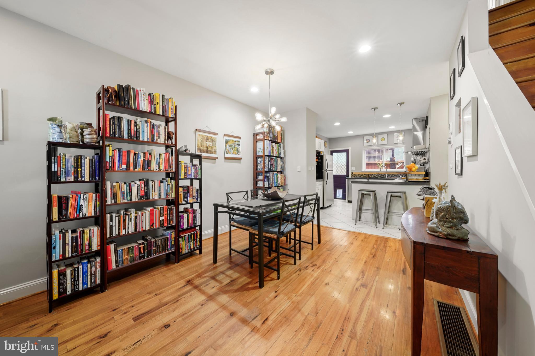 1318 South Alder Street Philadelphia, PA 19147 - Photo 12 of 39 a living room with lots of furniture and a book shelf