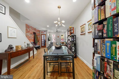 a view of a livingroom with furniture and stairs