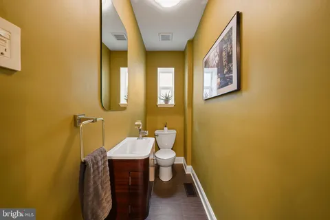a bathroom with a sink and toilet