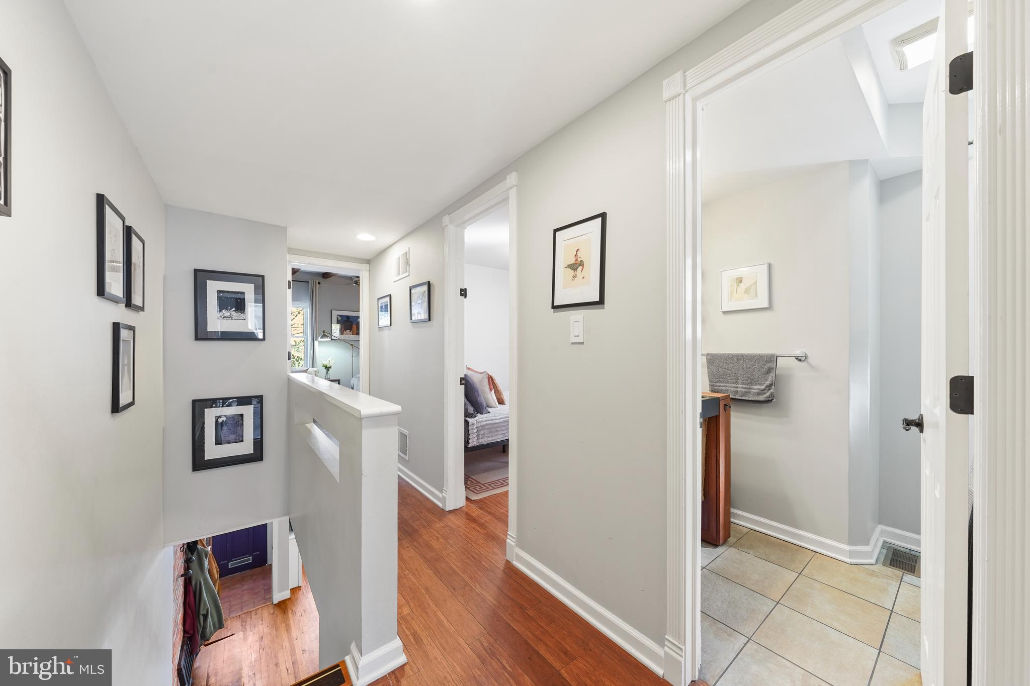 1318 South Alder Street Philadelphia, PA 19147 - Photo 23 of 39 a view of a hallway with wooden floor and a living room