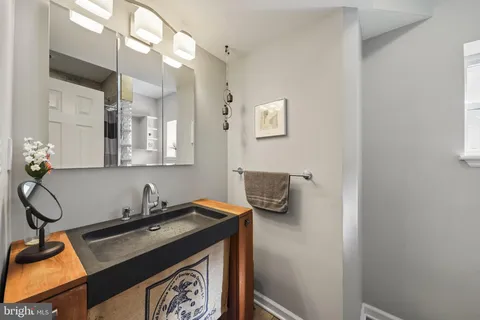 a bedroom with a bed and a lamp