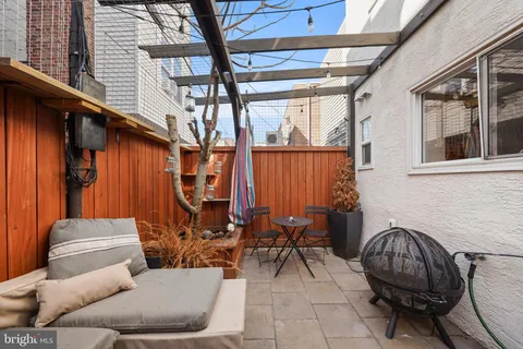 a backyard of a house with outdoor seating