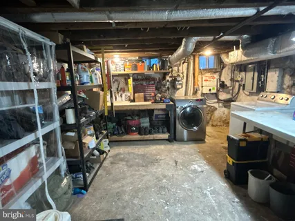 a room with gym equipment and a table