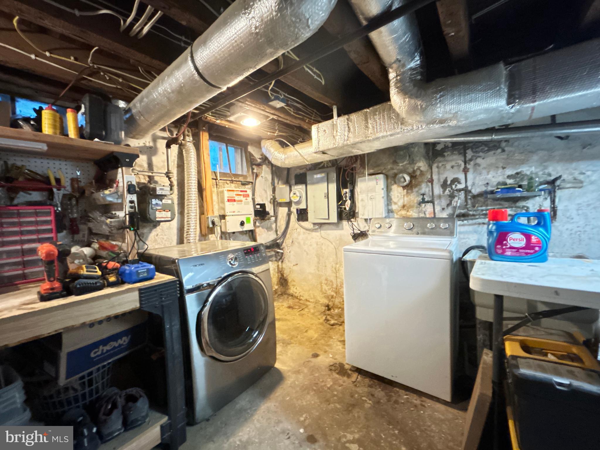 1318 South Alder Street Philadelphia, PA 19147 - Photo 38 of 39 a utility room with dryer washer and a water heater