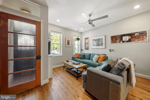 a living room with furniture and a window